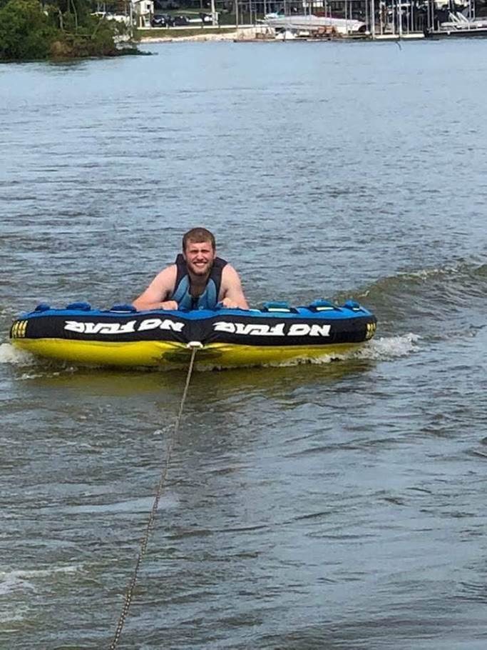 Man riding on tube on the Ohio River