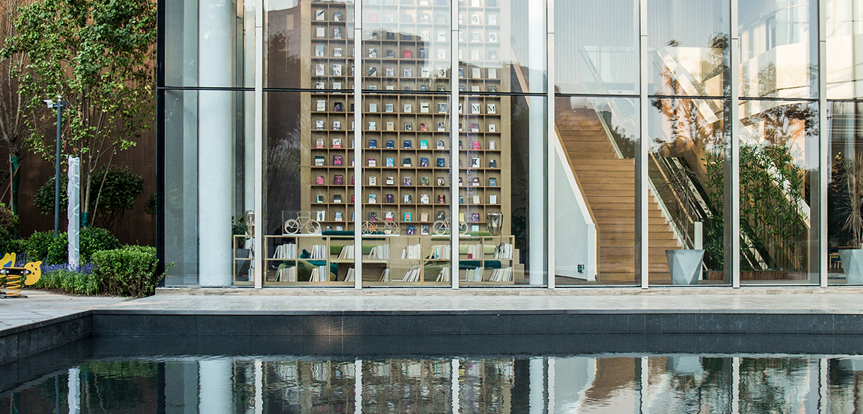 Image of a bookstore on the other side of the glass walls.