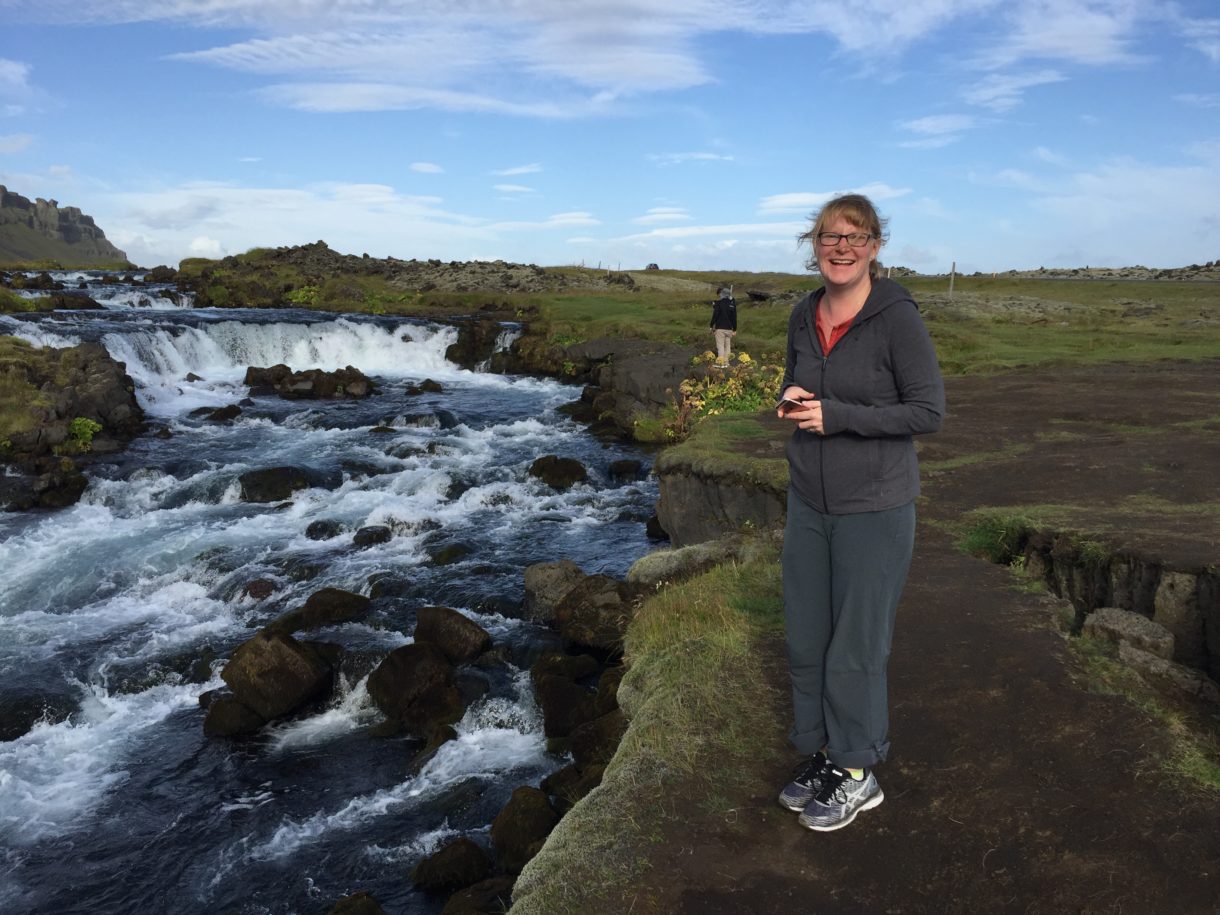Woman standing by water