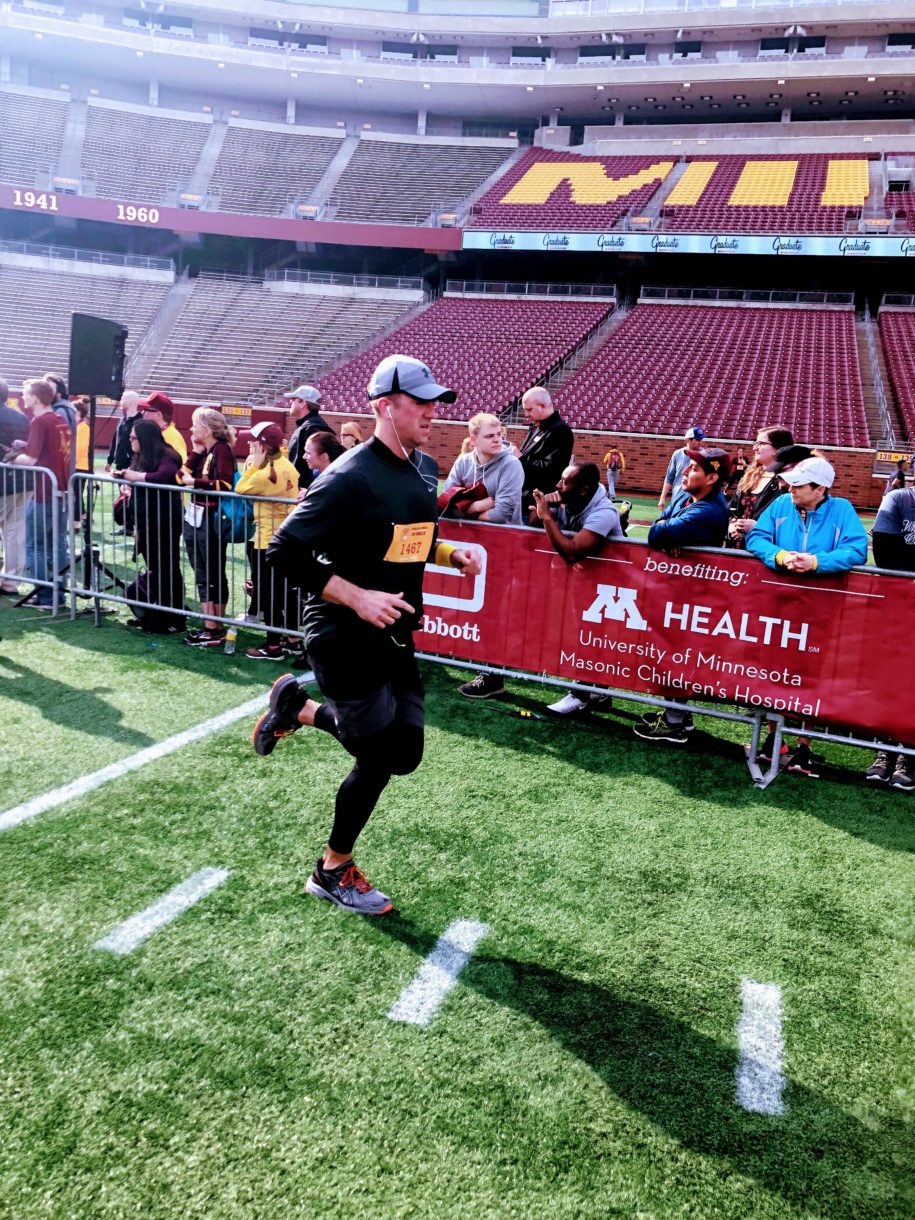Man running on football field