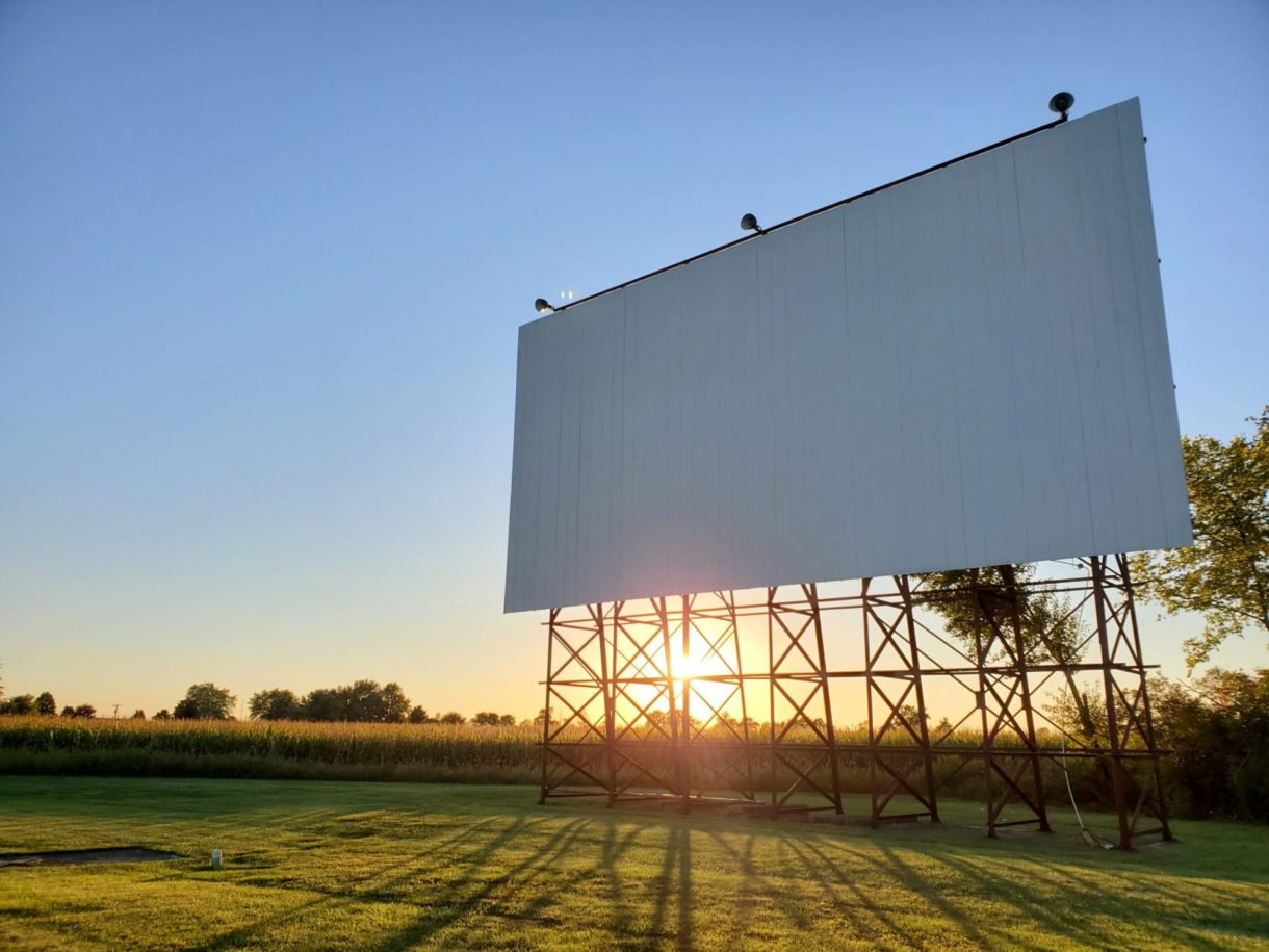 drive in movie theater screen in a field