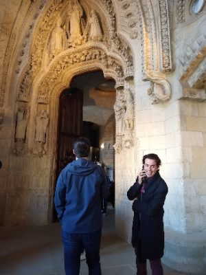man standing in front of cathedral