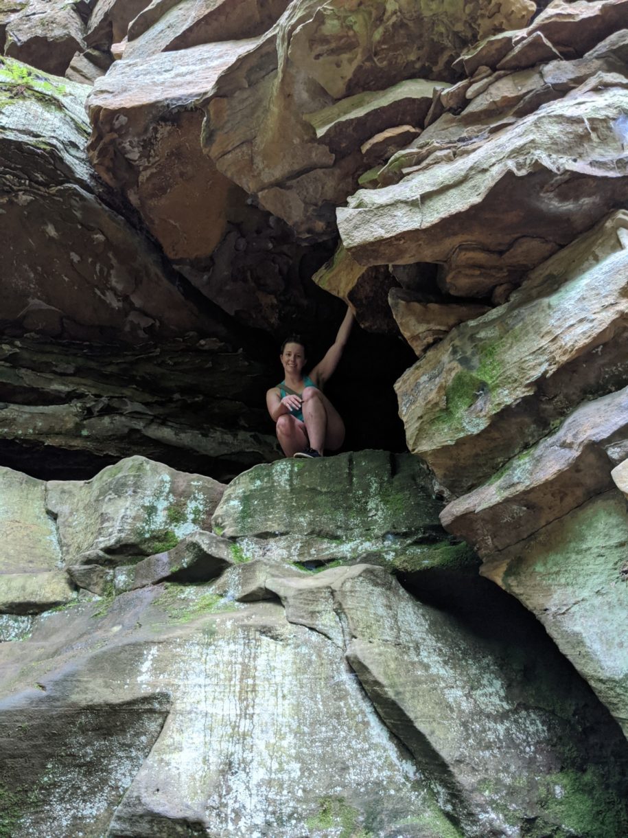 woman sitting in cave