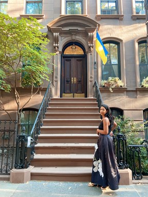 woman in front of building with stairs